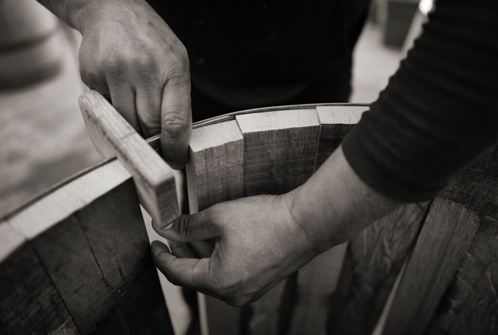 Man assembling a barrel by hand