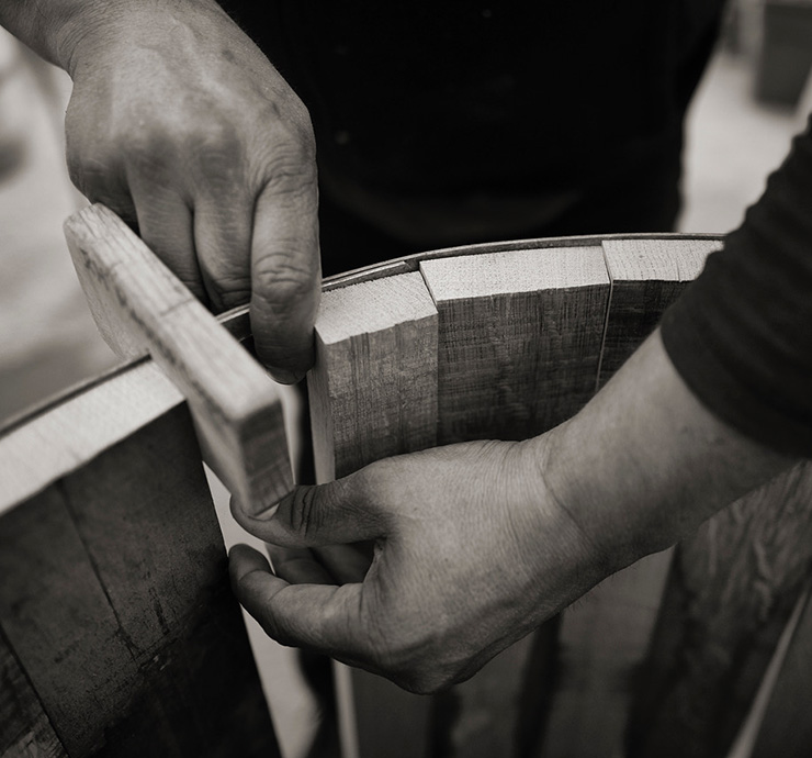 Man assembling a barrel by hand