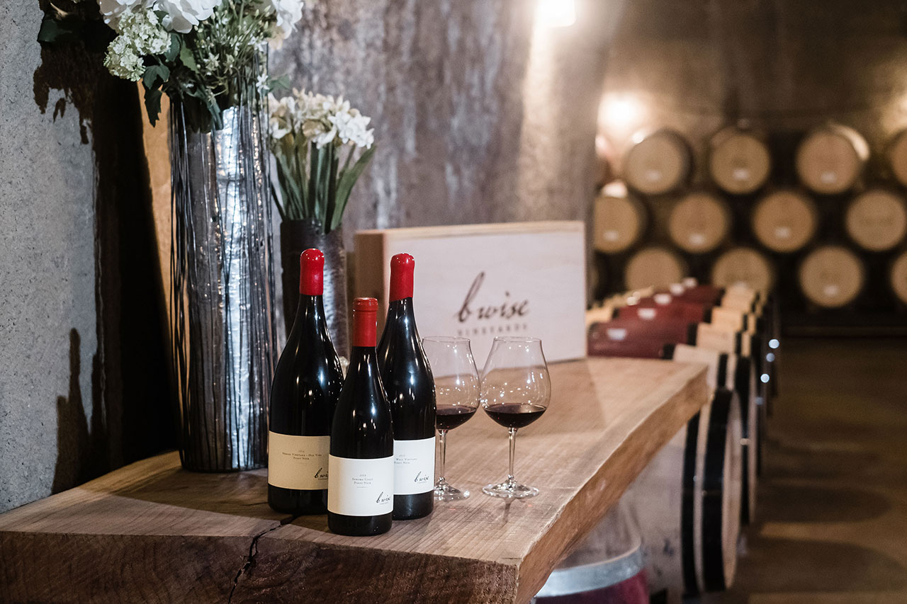 Bottles of B.Wise wine set up for a tasting in B.Wise barrel room