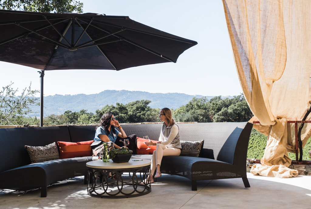 Two women drinking wines on the B. Wise Tasting Terrace