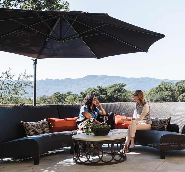 Two women drinking wines on the B. Wise Tasting Terrace