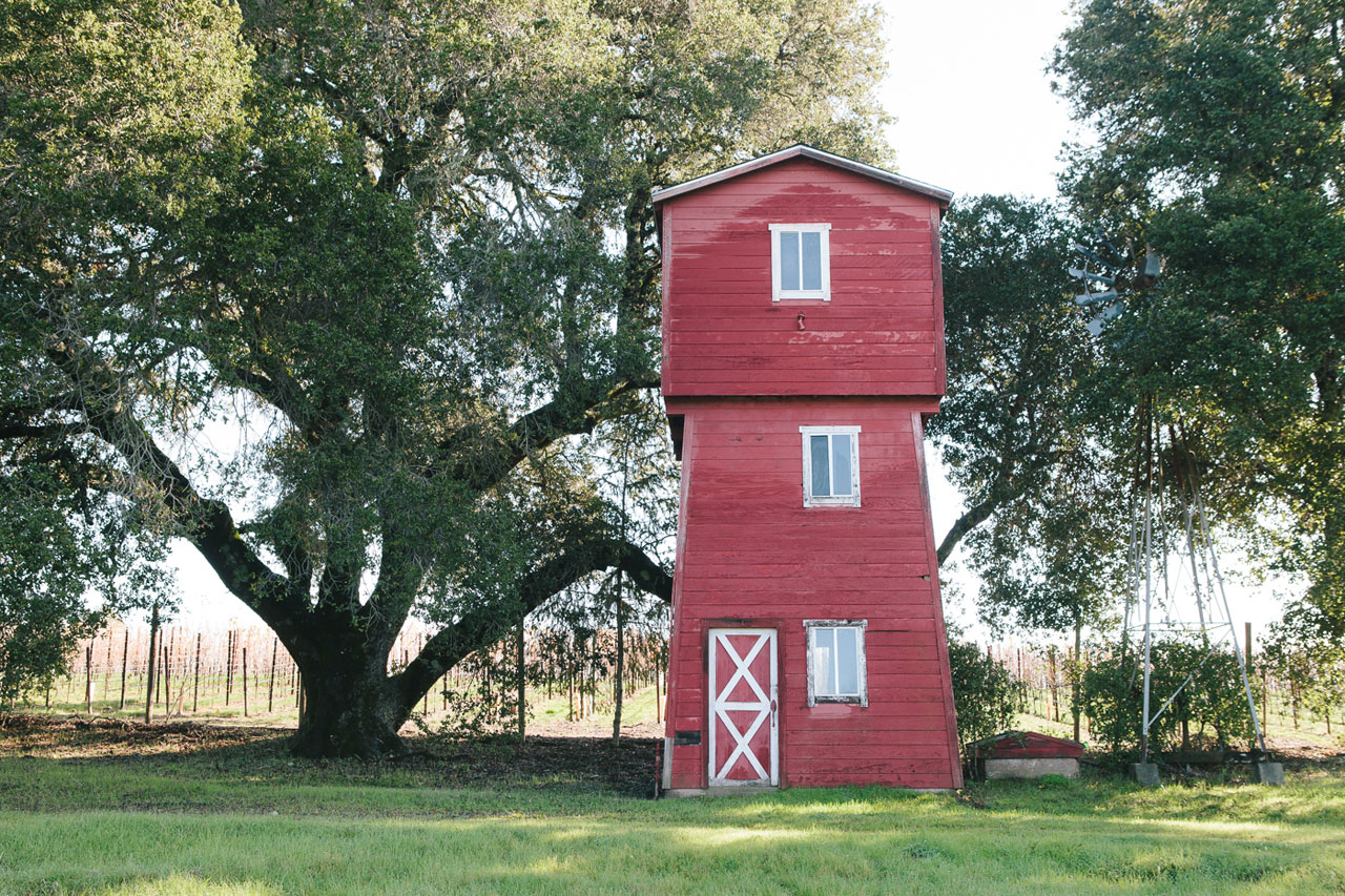 Front of red water tower at Lucky Well Vineyard